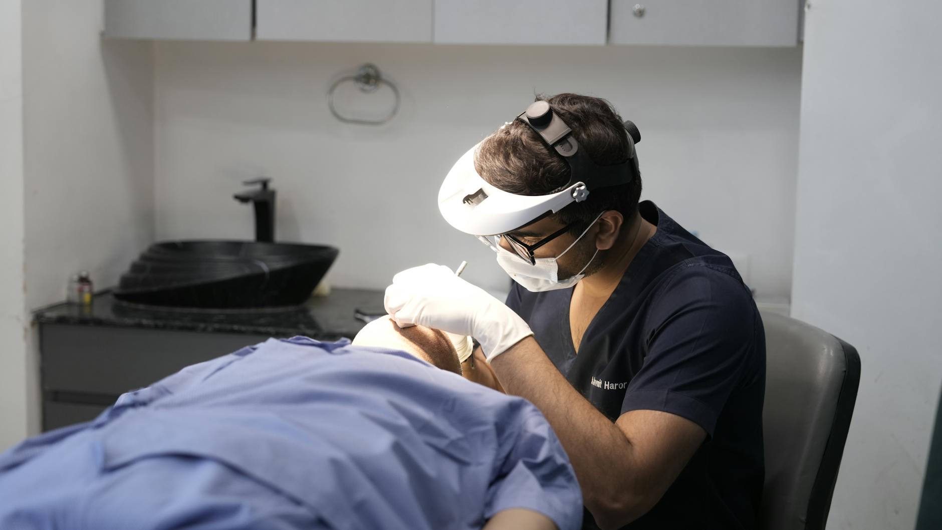 Dermatologist reviewing patient chart in clinic setting, illustrating complexity of dermatology coding and billing for outsourced billing services