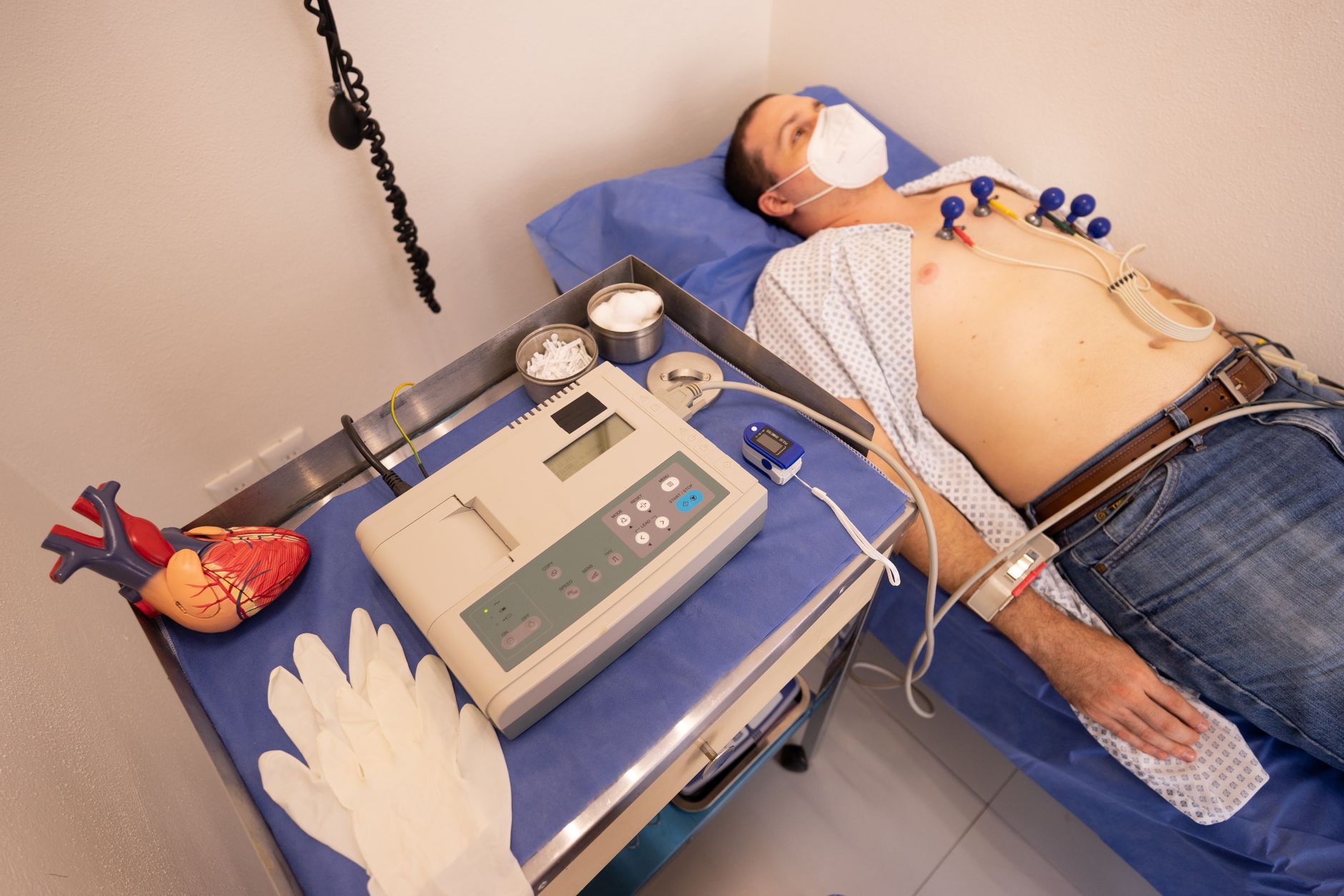 Cardiologist reviewing cardiac stress test ECG tracing results, illustrating the professional component of cardiac stress test billing CPT 9