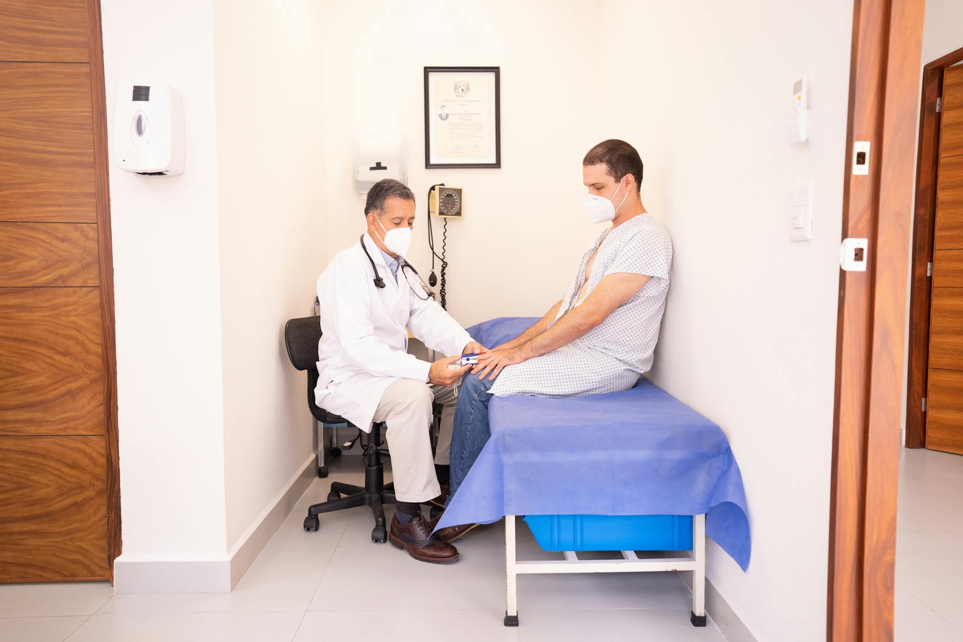 outsource medical billing for cardiology practices — Cardiologist reviewing patient records in clinic, illustrating the complexity driving c