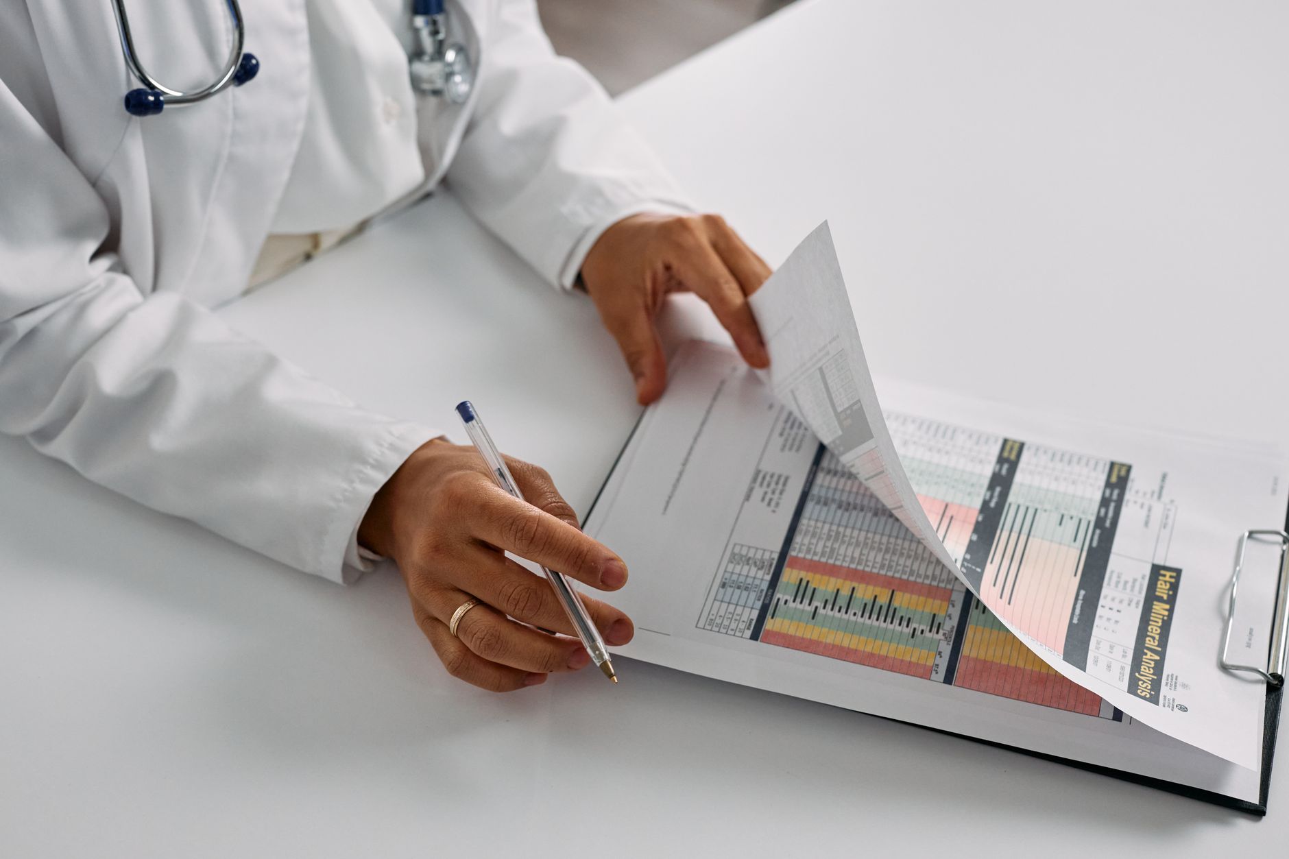 reduce days in accounts receivable — Physician reviewing accounts receivable aging report on laptop to reduce days in AR and improve billing